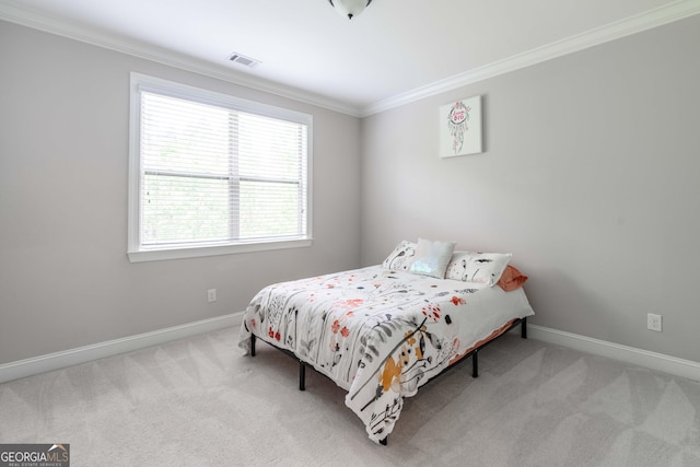 carpeted bedroom with ornamental molding