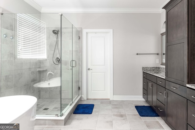 bathroom featuring vanity, ornamental molding, and shower with separate bathtub