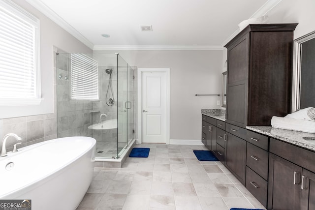 bathroom with crown molding, vanity, and shower with separate bathtub