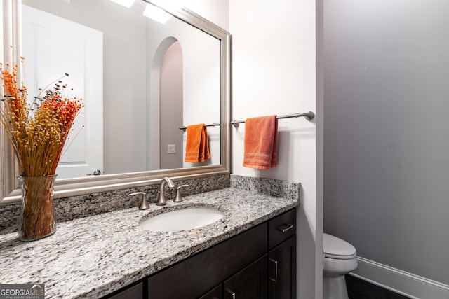 bathroom with vanity and toilet