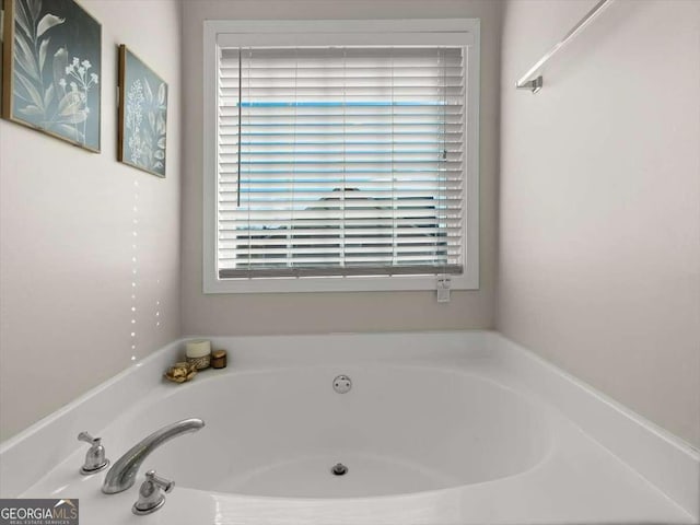 bathroom featuring a tub to relax in