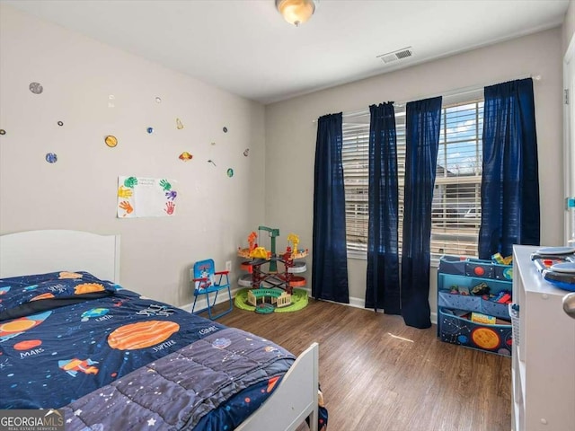 bedroom featuring hardwood / wood-style flooring