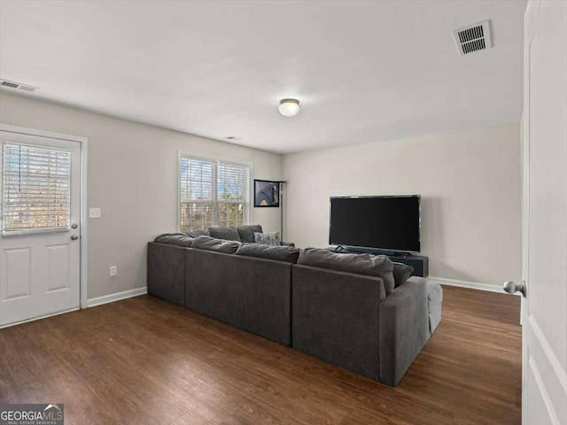 living room featuring dark hardwood / wood-style floors