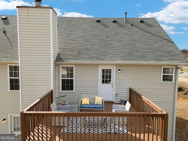 rear view of house with an outdoor hangout area and a deck