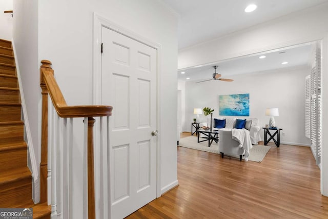 interior space featuring wood-type flooring and ornamental molding