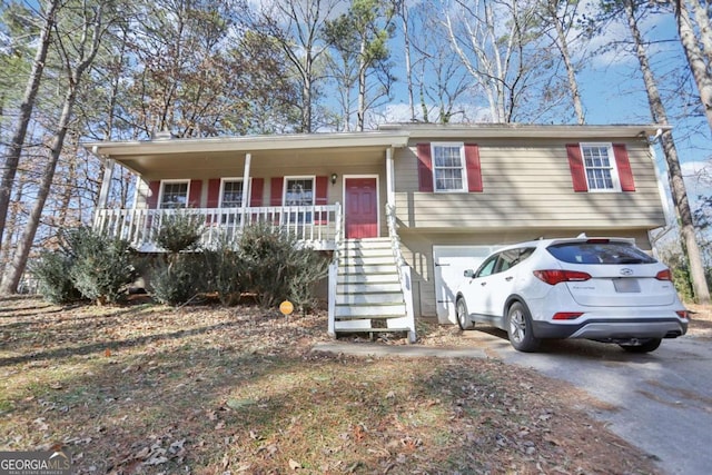 view of front of property with a garage and a porch