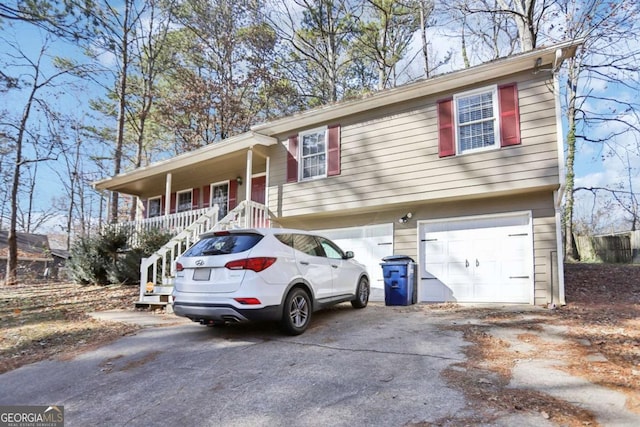 view of front of property featuring a garage and a porch