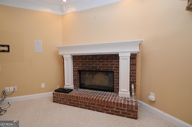 room details with ornamental molding, a brick fireplace, and carpet