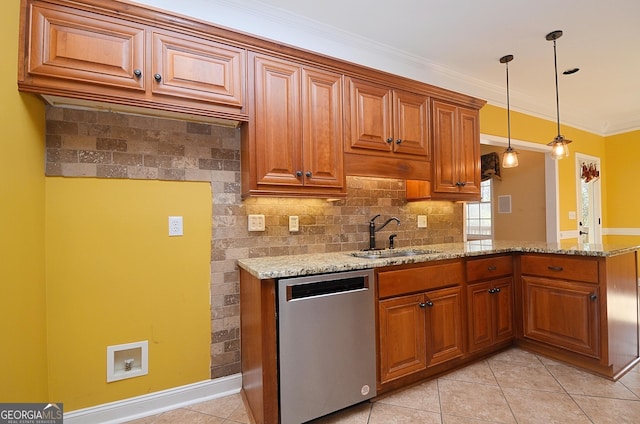 kitchen with decorative light fixtures, dishwasher, sink, and light stone countertops