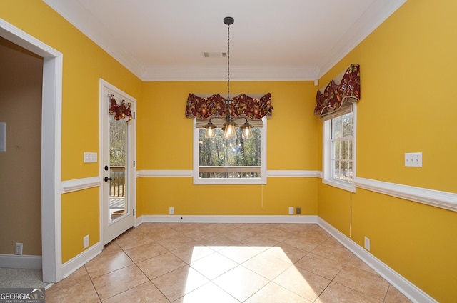 unfurnished dining area with light tile patterned floors, ornamental molding, and a chandelier