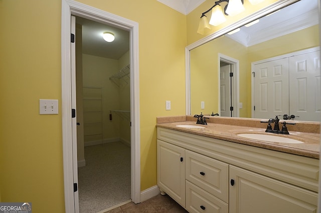 bathroom with vanity, ornamental molding, and tile patterned floors