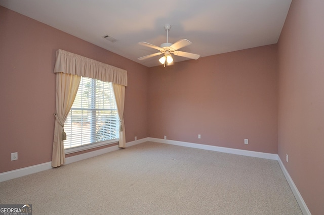 carpeted empty room with ceiling fan