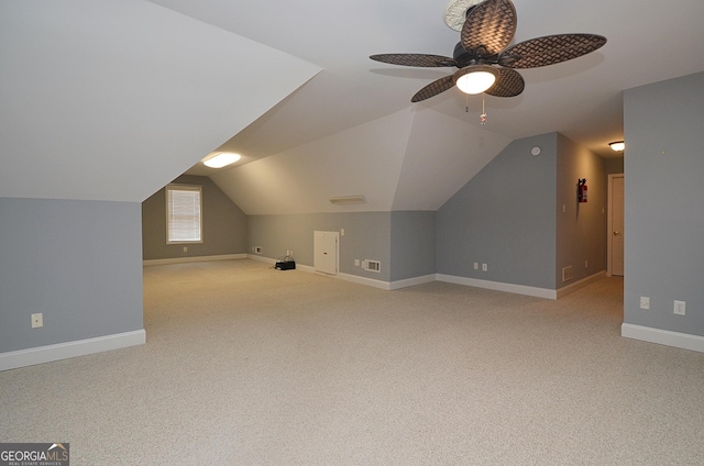 bonus room featuring light colored carpet and lofted ceiling