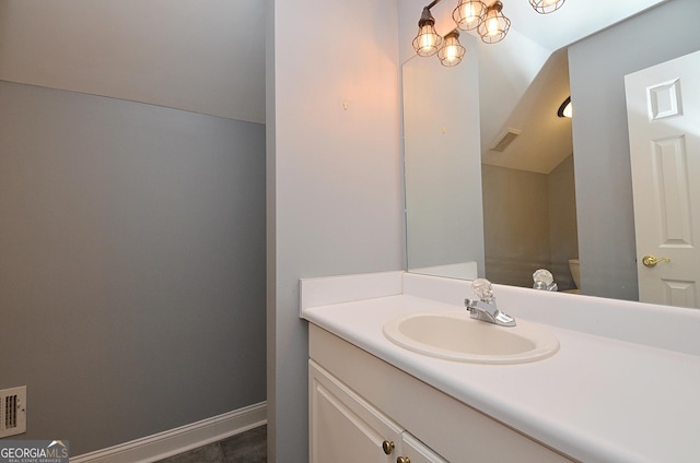 bathroom with vanity and toilet