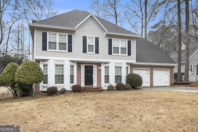 front of property featuring a garage and a front yard