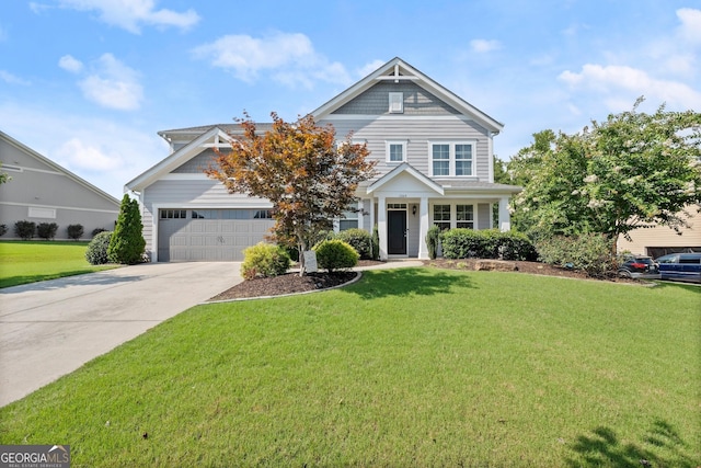 view of front facade featuring a garage and a front lawn