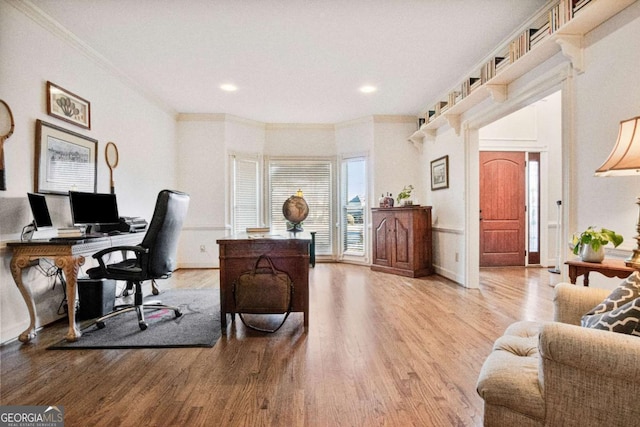 office space with ornamental molding and hardwood / wood-style floors