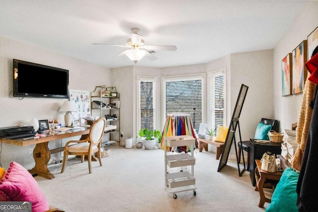 office area with light carpet and ceiling fan