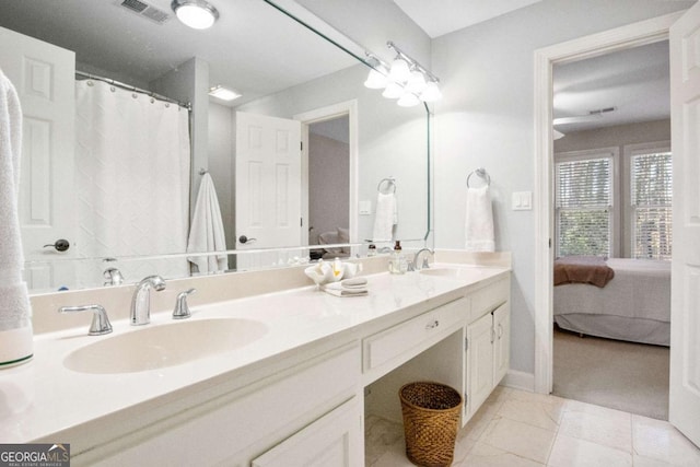 bathroom with vanity and tile patterned flooring