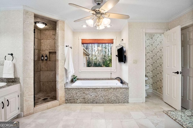 full bathroom featuring crown molding, vanity, toilet, and independent shower and bath