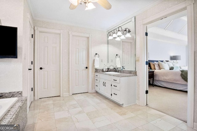 bathroom with ceiling fan, ornamental molding, and vanity