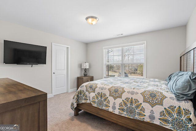 bedroom featuring light colored carpet