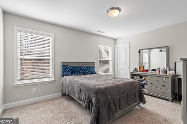 bedroom with light carpet