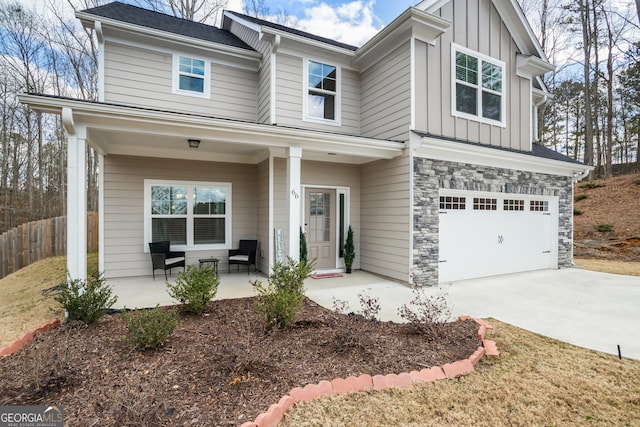 view of front of home with a garage and a porch