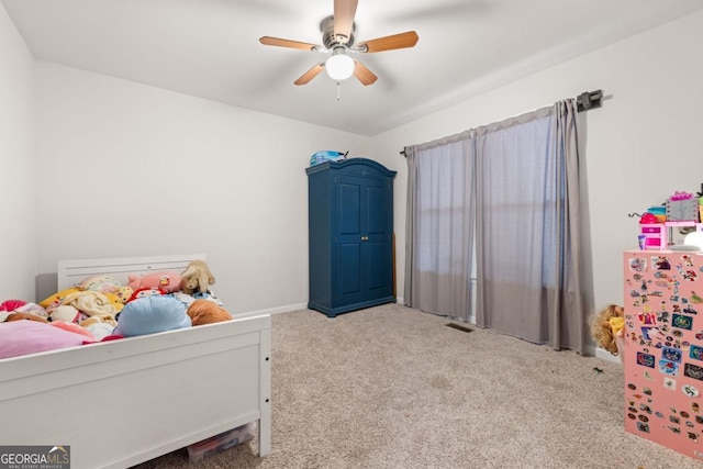 carpeted bedroom with ceiling fan