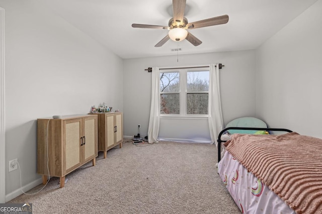 bedroom featuring ceiling fan and light colored carpet