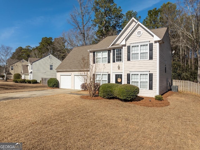 view of front of house featuring a garage and a front lawn