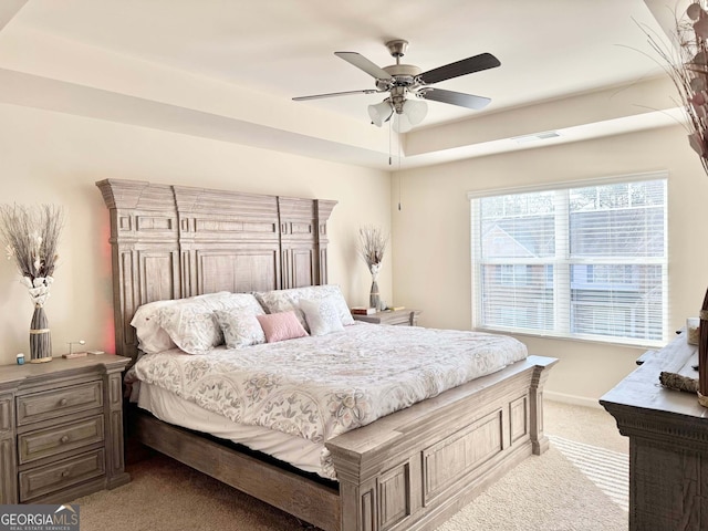 bedroom with light colored carpet and ceiling fan