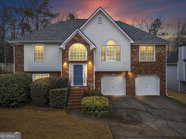 split foyer home featuring a garage