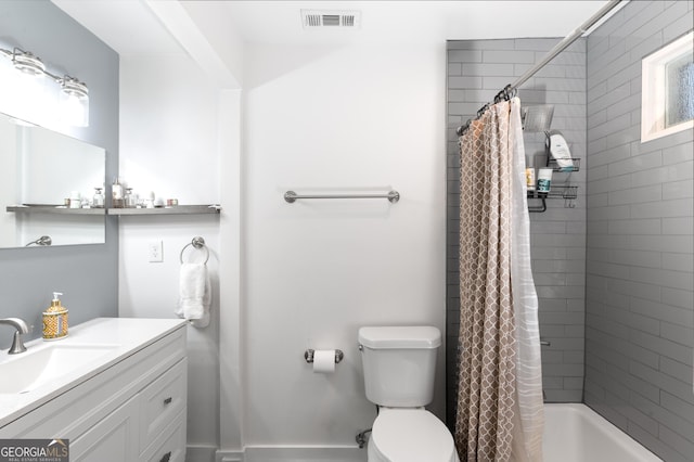 full bathroom with vanity, toilet, and shower / bath combo