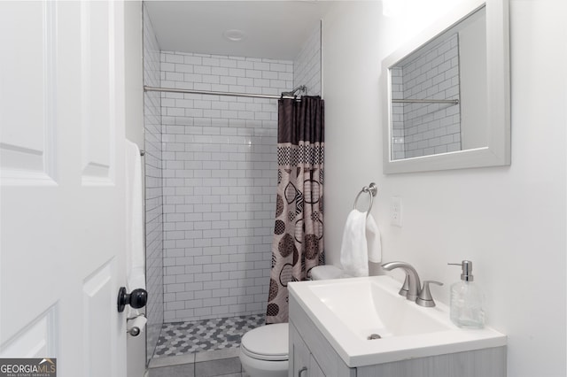 bathroom with vanity, toilet, and curtained shower