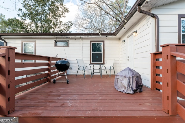 wooden deck featuring area for grilling