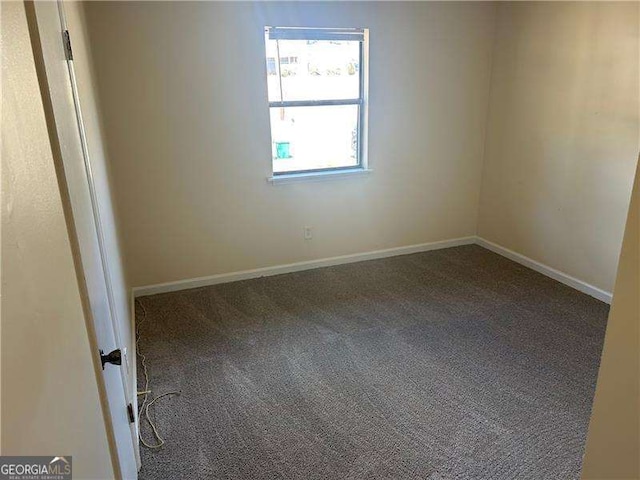 unfurnished room featuring carpet flooring