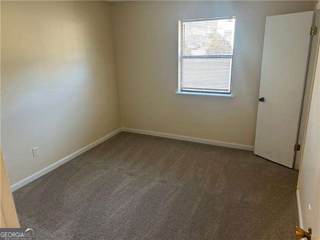 empty room featuring carpet flooring