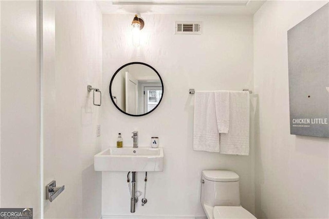 bathroom with sink and toilet