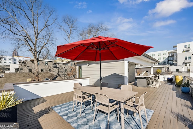 wooden terrace with a bar