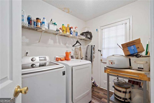 washroom featuring dark hardwood / wood-style floors, a textured ceiling, and independent washer and dryer