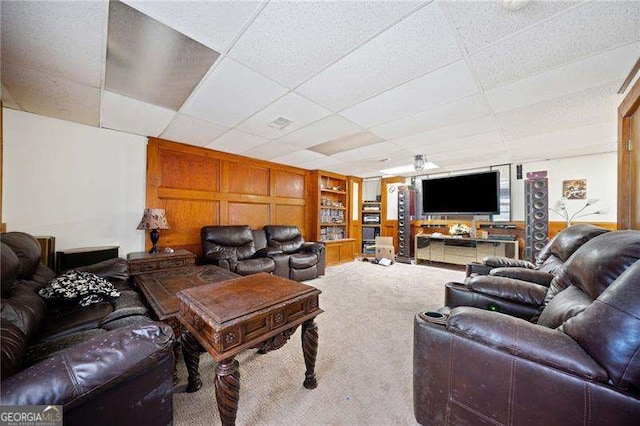 carpeted living room featuring built in shelves