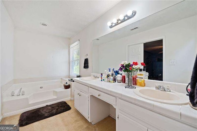 bathroom with vanity and a bath