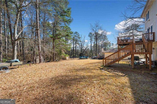 view of yard with a wooden deck