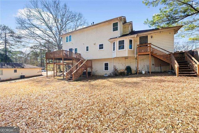 back of property with a wooden deck