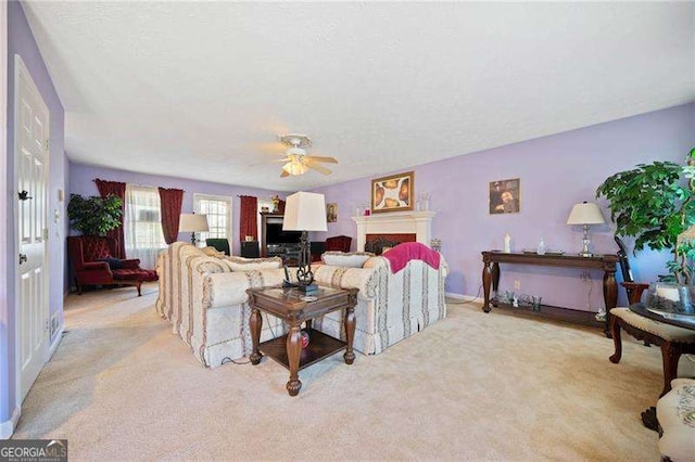 living room with light carpet and ceiling fan