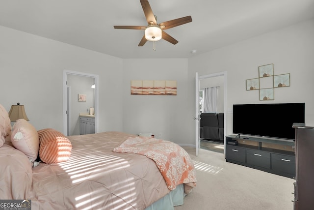 carpeted bedroom featuring ensuite bathroom and ceiling fan