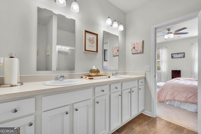 bathroom featuring ceiling fan, vanity, and hardwood / wood-style floors