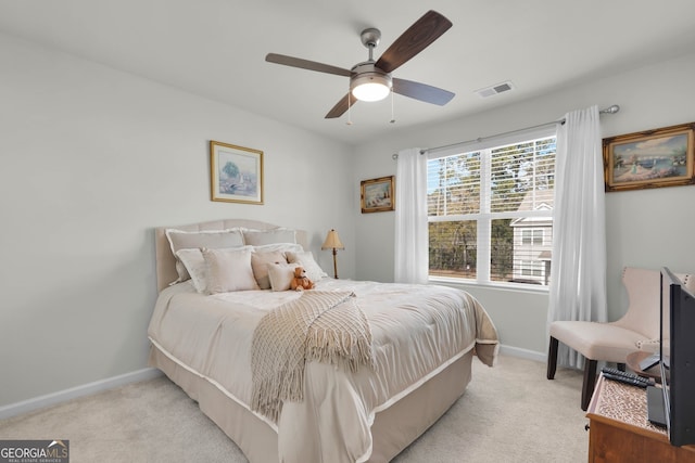 bedroom featuring light carpet and ceiling fan