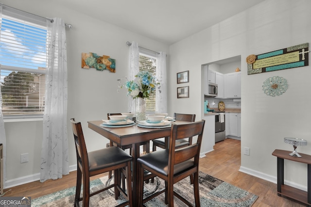 dining room with light hardwood / wood-style floors